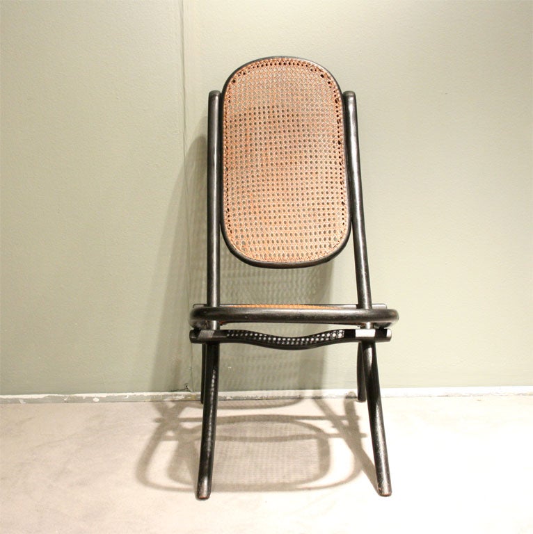 Thonet Bentwood Folding Chair with ebonized finish and old caning, unmarked.